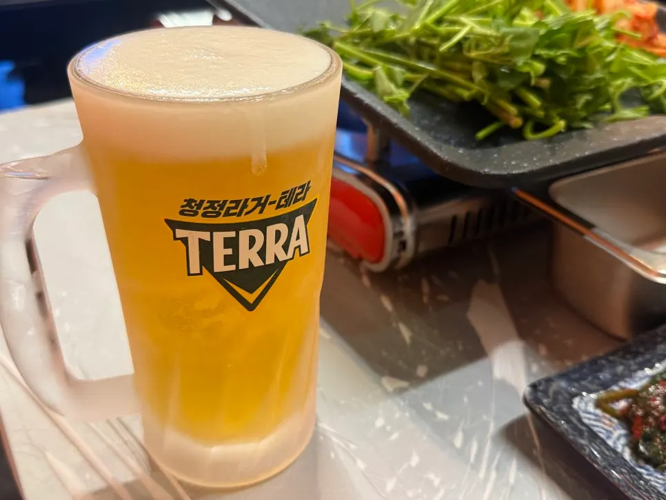 A glass of draft beer ordered at Minari Naengsam