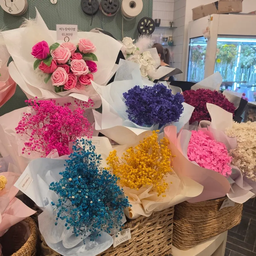 Various potted plants seen at the flower shop