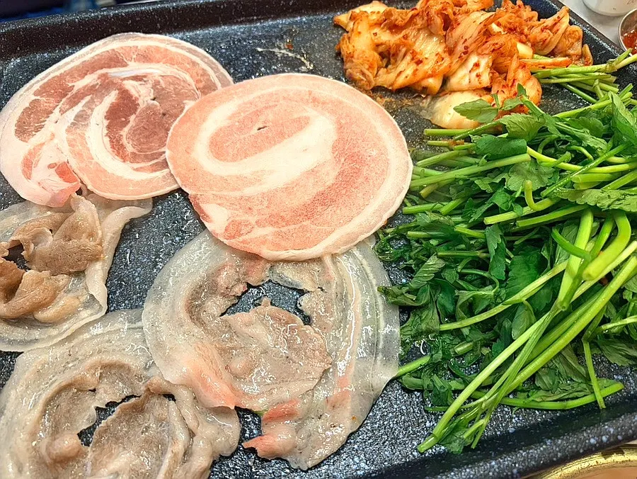 Flower naengsam and minari cooking on the grill