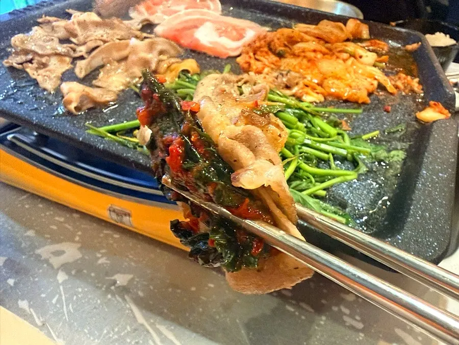 Minari flower naengsam topped with mustard leaf kimchi