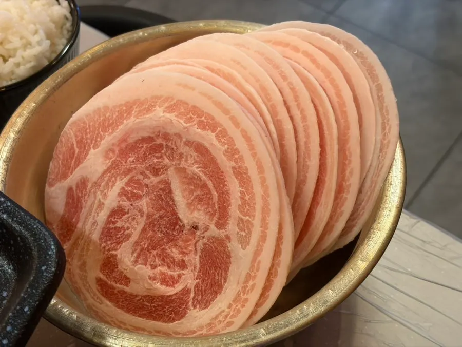 3 servings of frozen pork belly on a plate