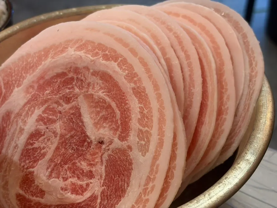 Close-up of thinly sliced frozen pork belly