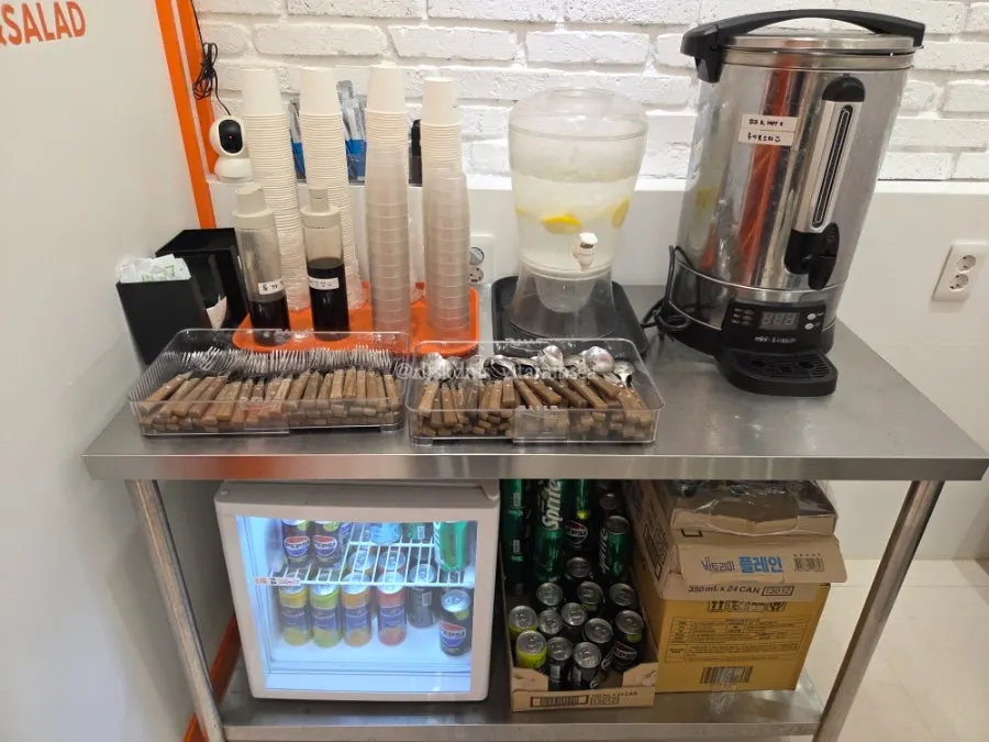 Self-service corner with sauces and cutlery