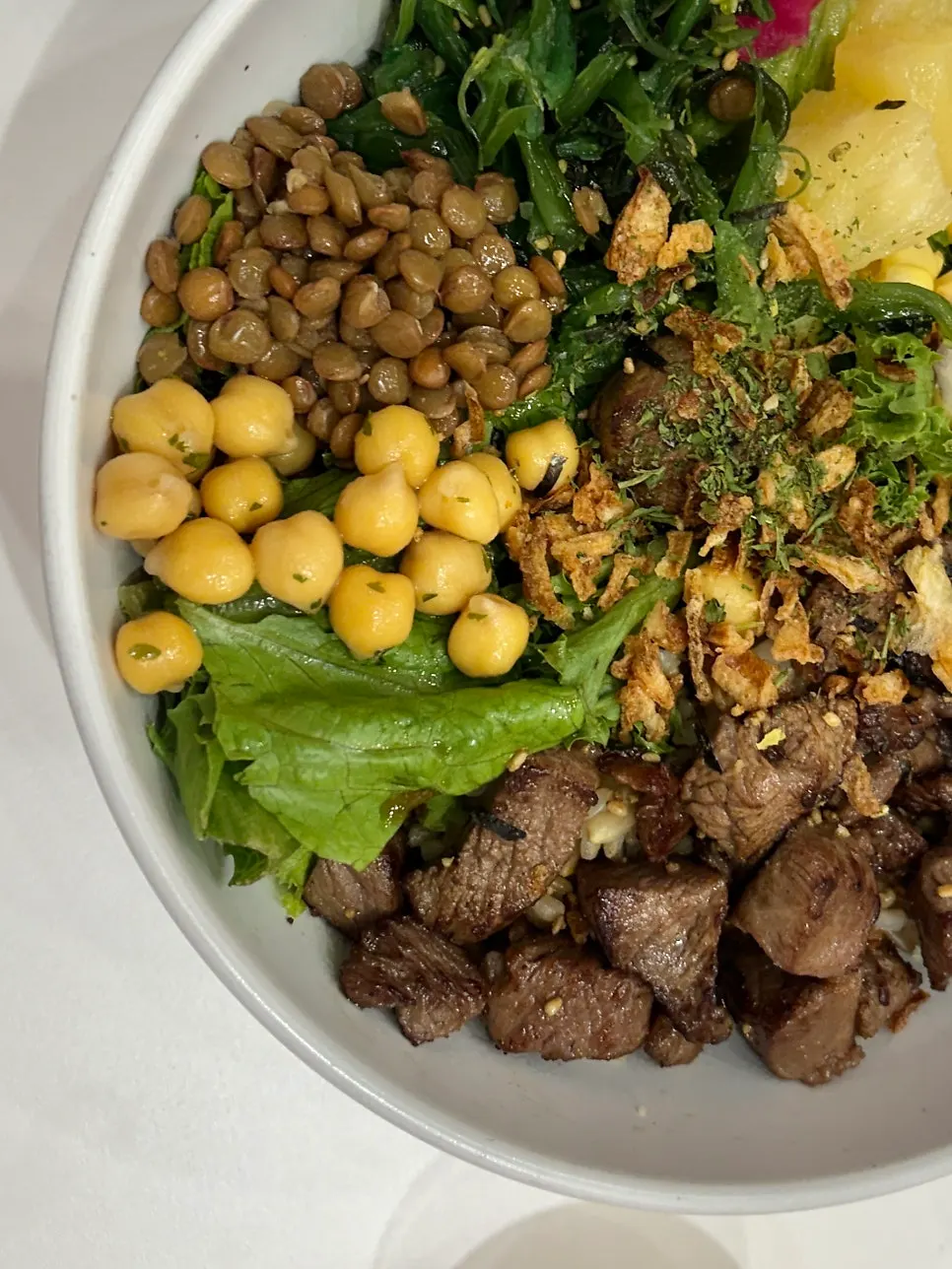 Steak Poke with sesame soy base and wasabi mayo sauce