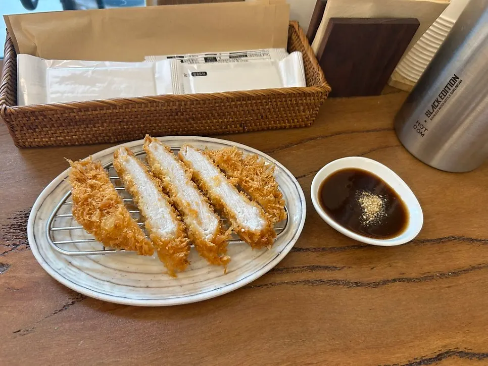 Tonkatsu on a wire rack with sauce served separately