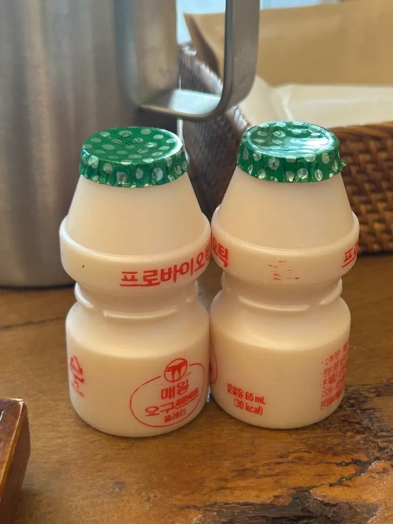 Two bottles of yogurt given as dessert