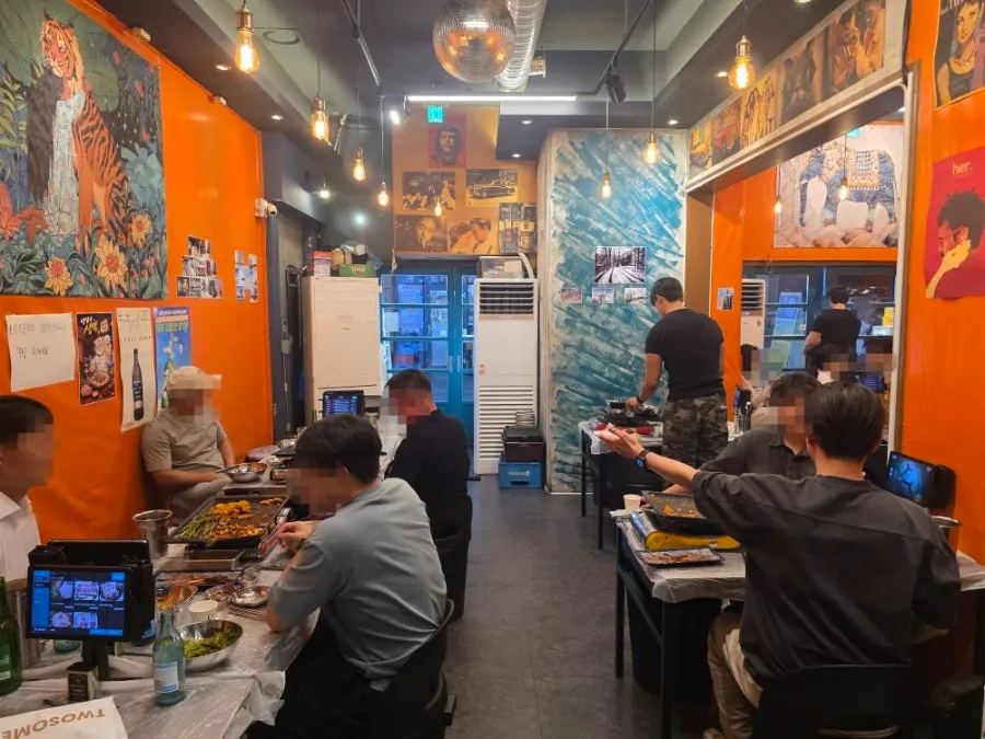 Long interior stretching back with tables on both sides