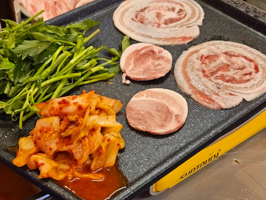 Rolled-up minari flower naengsam before grilling