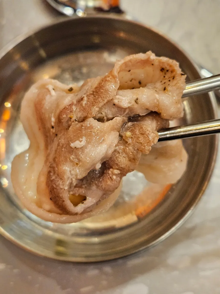 Vertical close-up of a cooked piece of naengsam