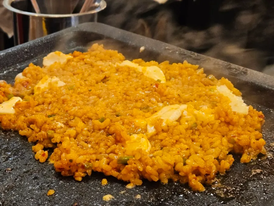 Hairtail-jeotgal fried rice frying on the grill plate