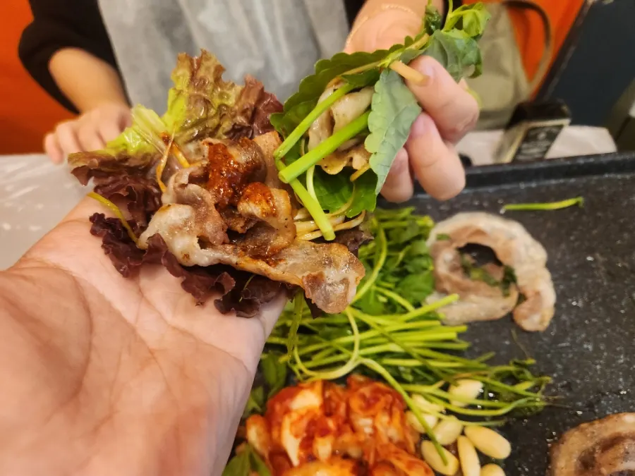 Naengsam and minari placed on a lettuce leaf