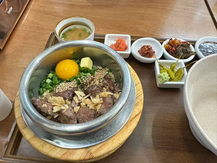 Side dish plate with pollock roe jeotgal, mustard leaf kimchi and more
