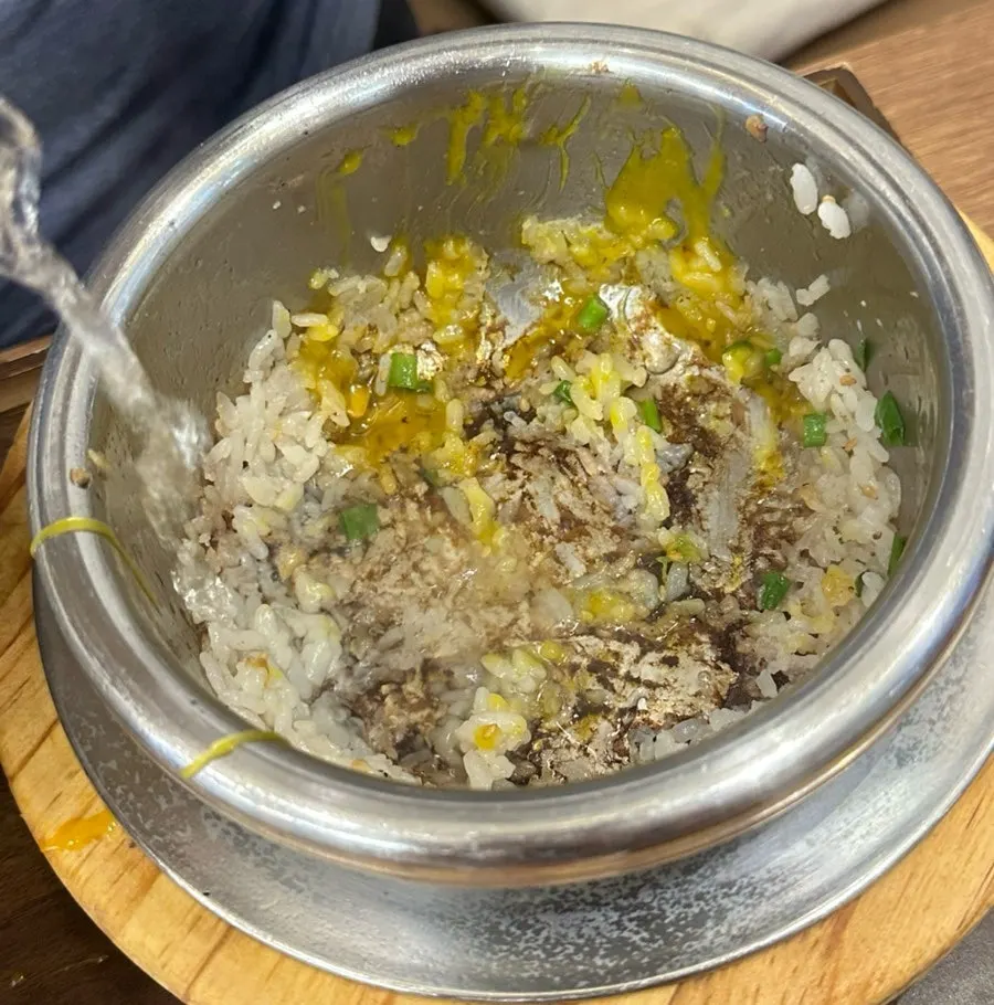 Pot rice mixed and served into a bowl