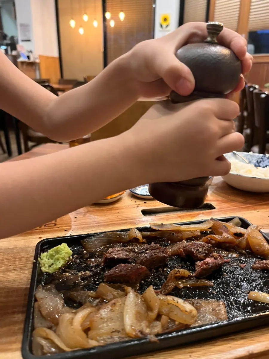 Small pieces of chuck flap steak served over rice