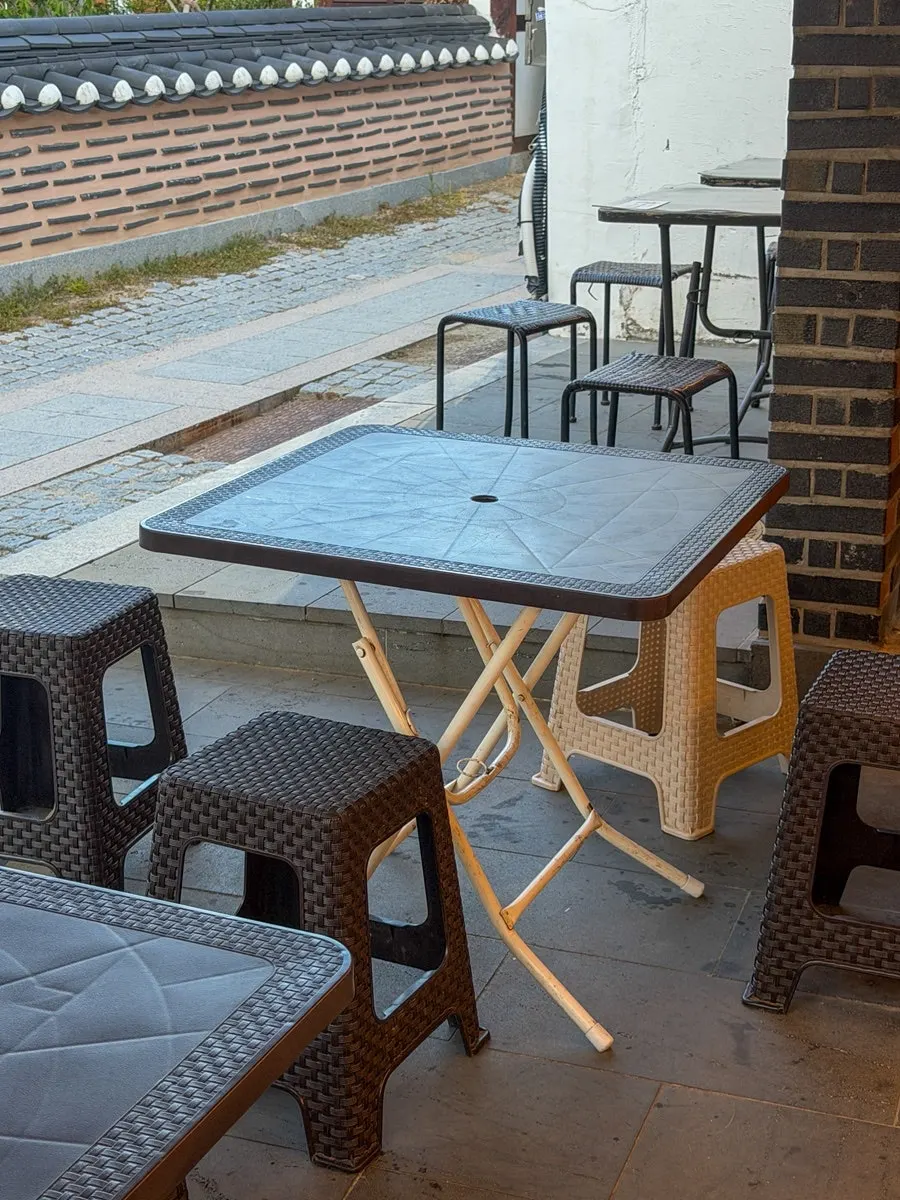Outdoor table seating next to the store