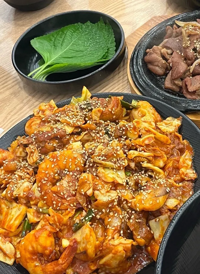 Rice ball topped with jjusamsae and pork belly