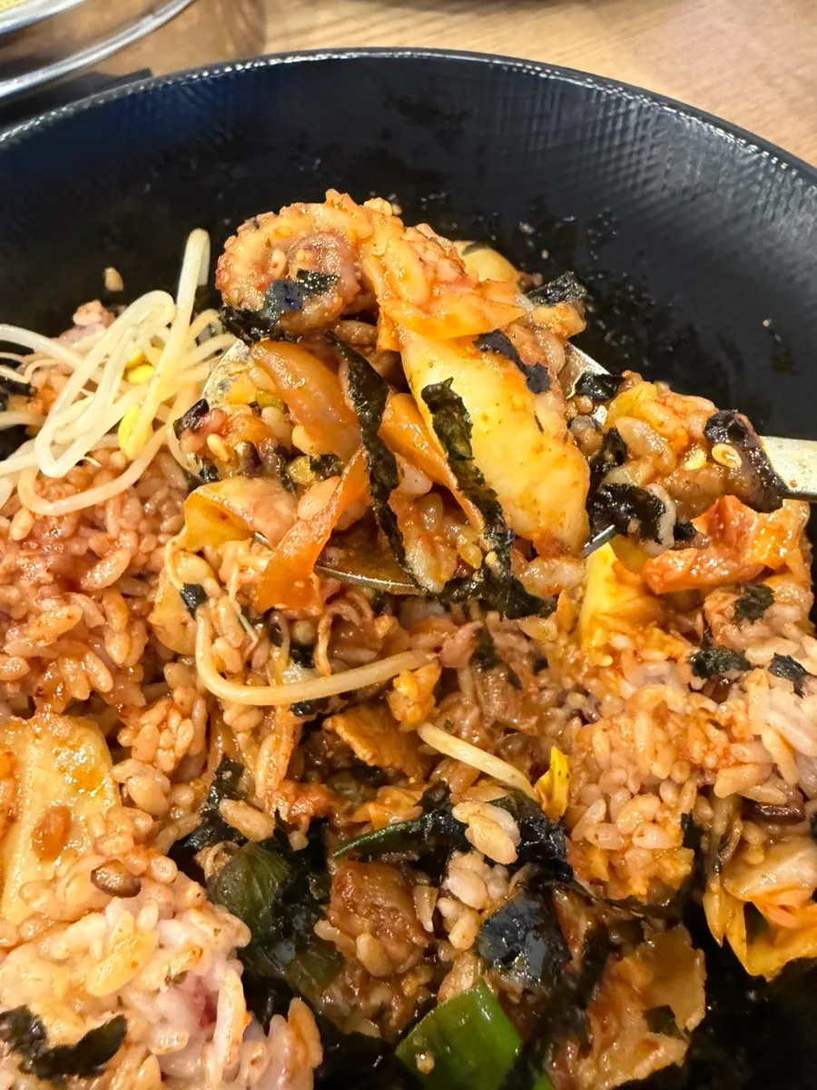 Jjukkumi deopbap mixed with seaweed flakes, flying fish roe, and sesame oil