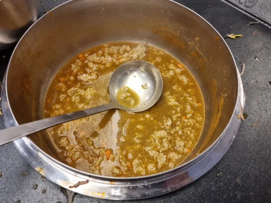 Close-up of a spoonful of abalone porridge