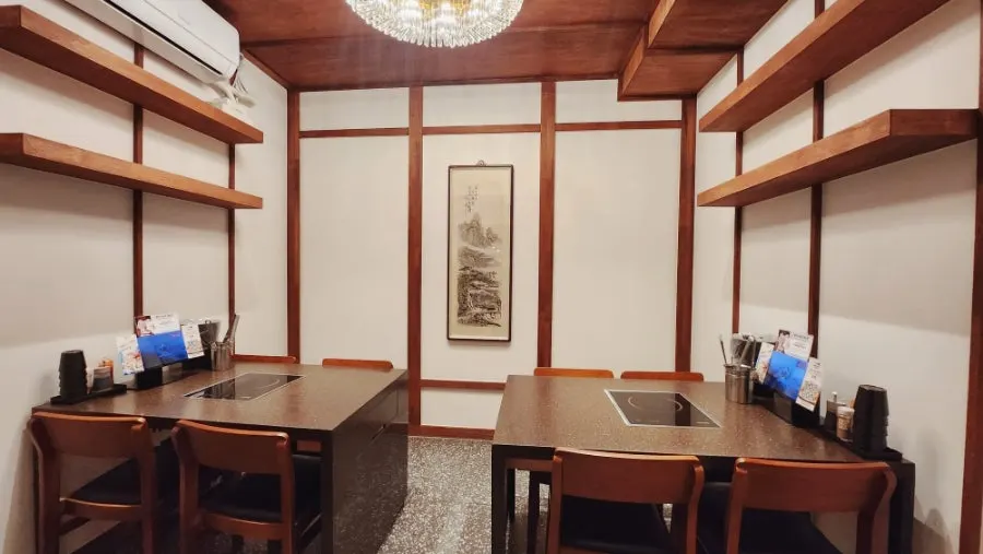 Interior of Palmi Jogae Kalguksu with a water mill and stream