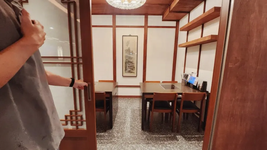Dining hall at Palmi Jogae Kalguksu with wide table spacing