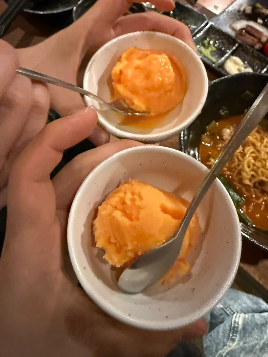 Side dishes of bibim noodles and seafood-packed ramyeon