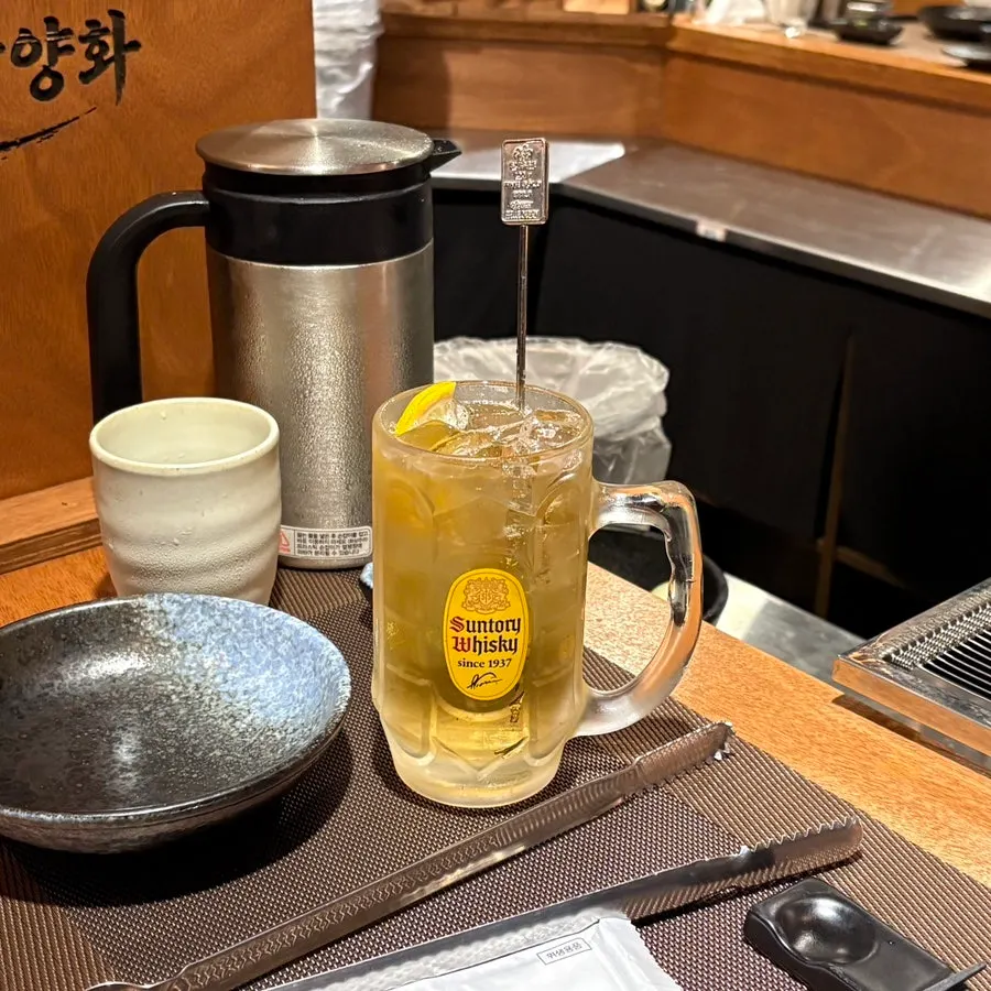 A glass of Suntory Highball ordered alongside the meal