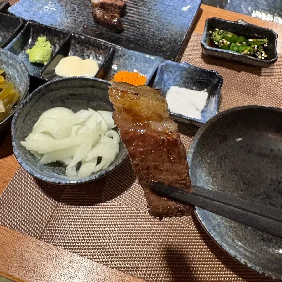 A piece of T-bone steak dipped in salt