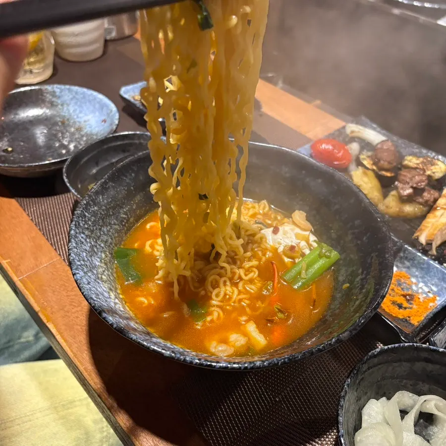 A bowl of spicy seafood ramyeon broth