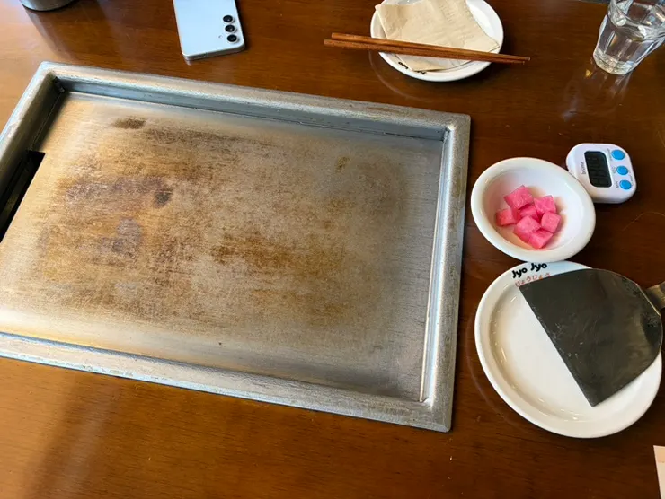 Interior of Jojo Mullae Branch with a griddle built into every table
