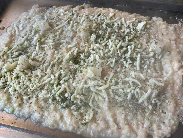 Finished mentaiko monjayaki spread thin across the griddle