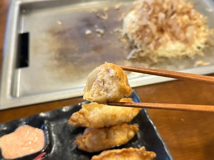 Picking up a piece of mentaiko gyoza