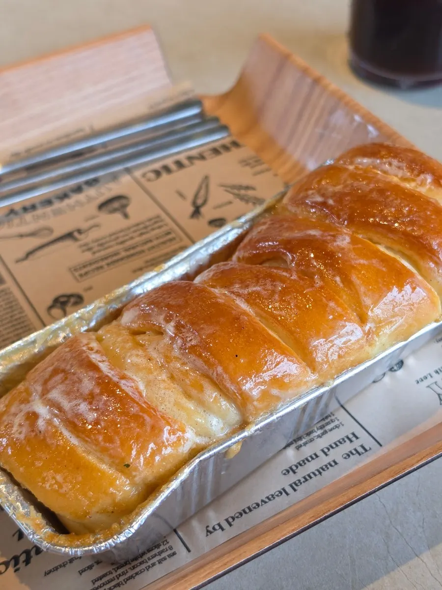 Iced americano and condensed milk bread on the table