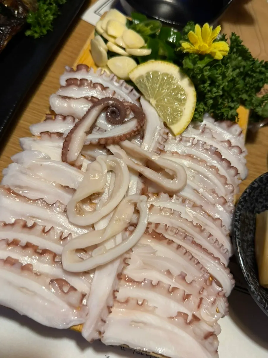 Neatly plated medium-size live octopus hwaloe