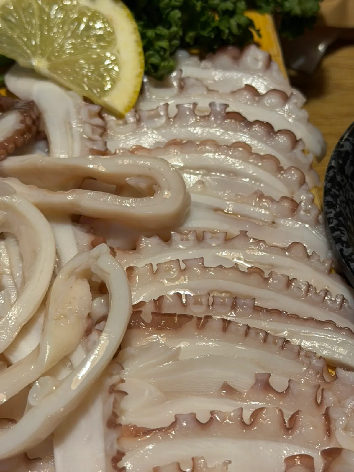 Octopus hwaloe paired with sesame oil sauce, chogochujang, and aged kimchi
