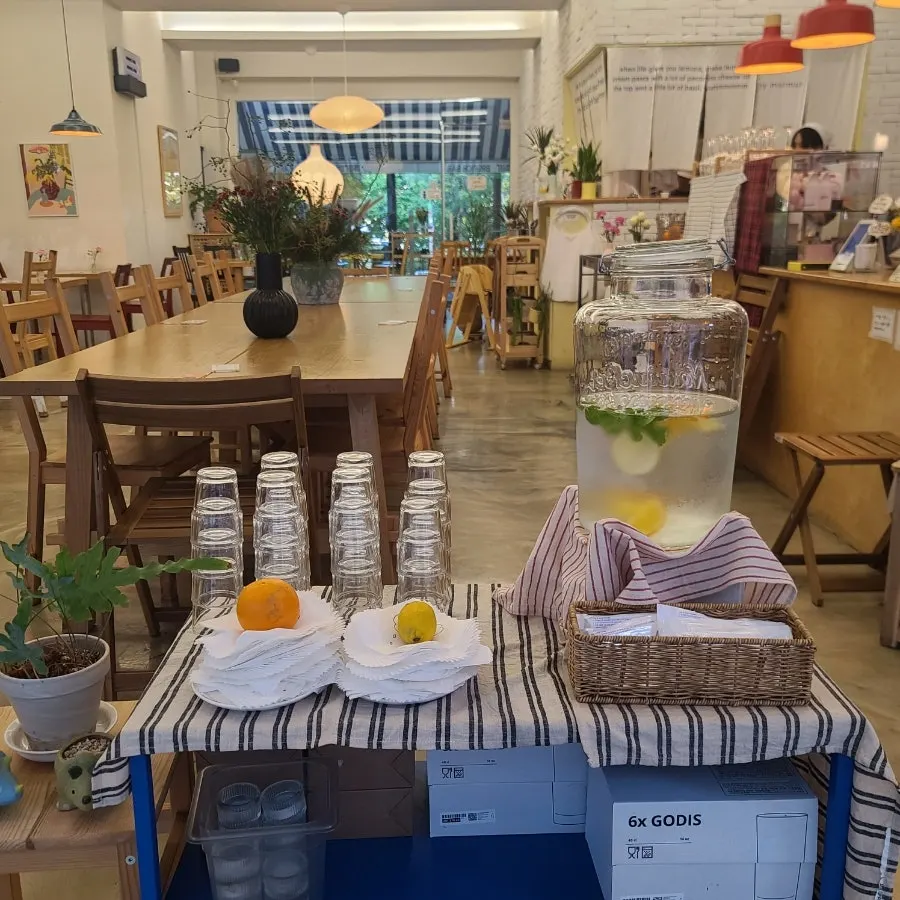 A two-seat wooden table at Meolmeol Pangyo