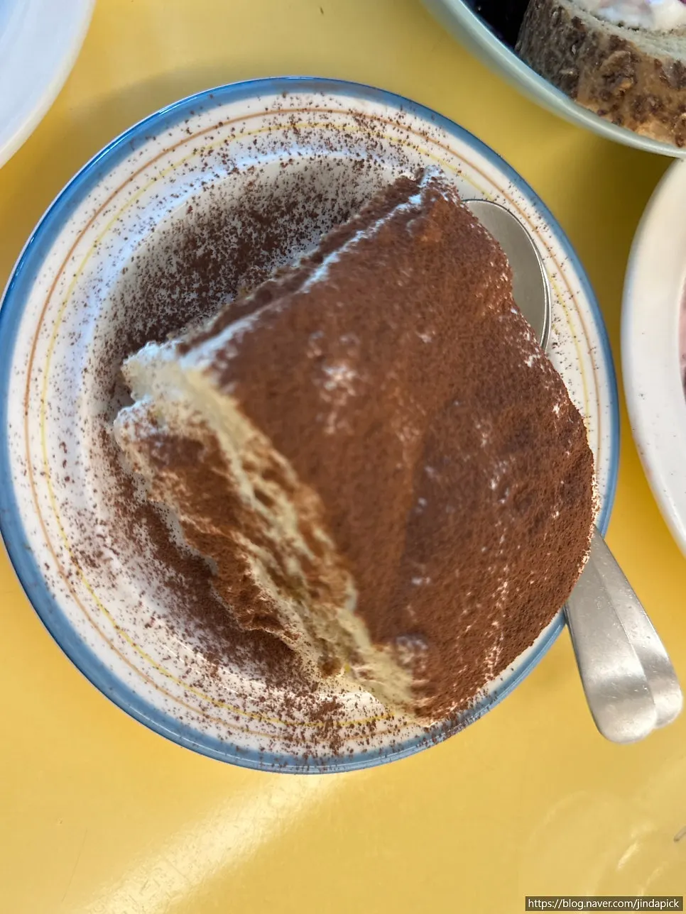 Tiramisu covered in a thick layer of cocoa powder