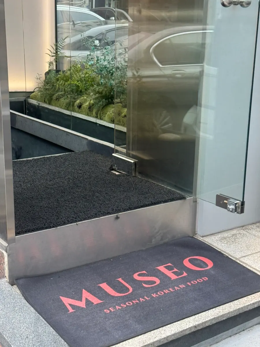 Staircase and lighting leading down to MUSEO's basement entrance