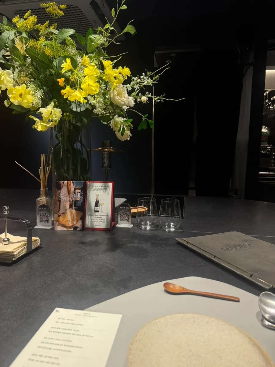 Bar table seating at MUSEO with flowers placed on it
