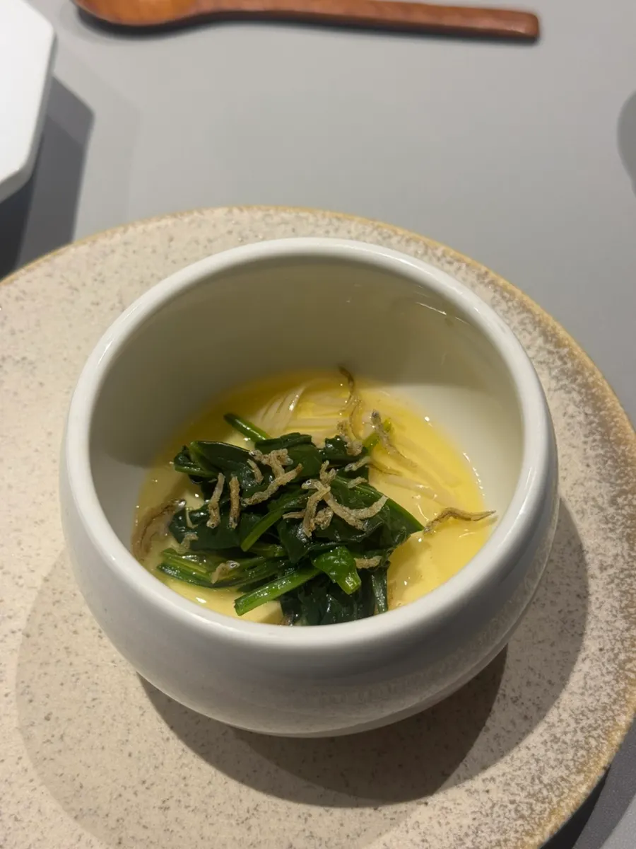 Steamed egg topped with Pohang spinach and fried anchovies