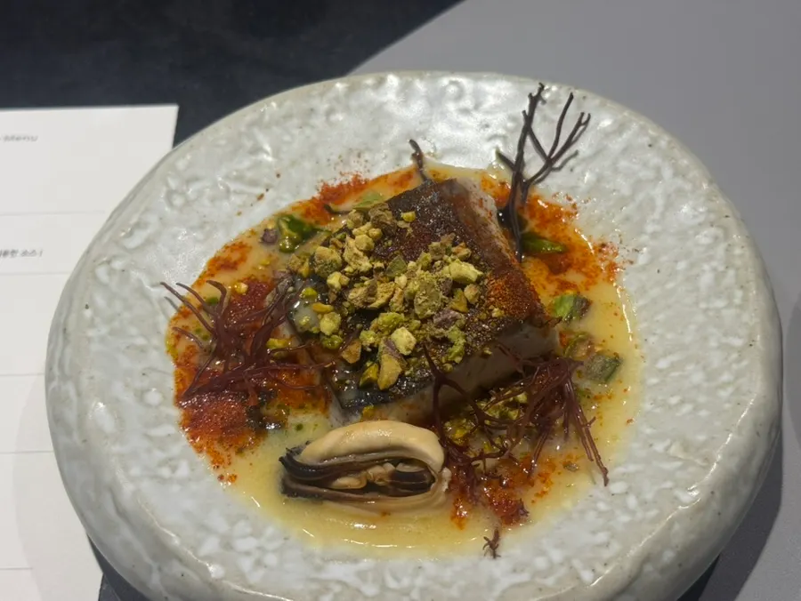 Rice-straw smoked Goheung Spanish mackerel with baek-kimchi beurre blanc