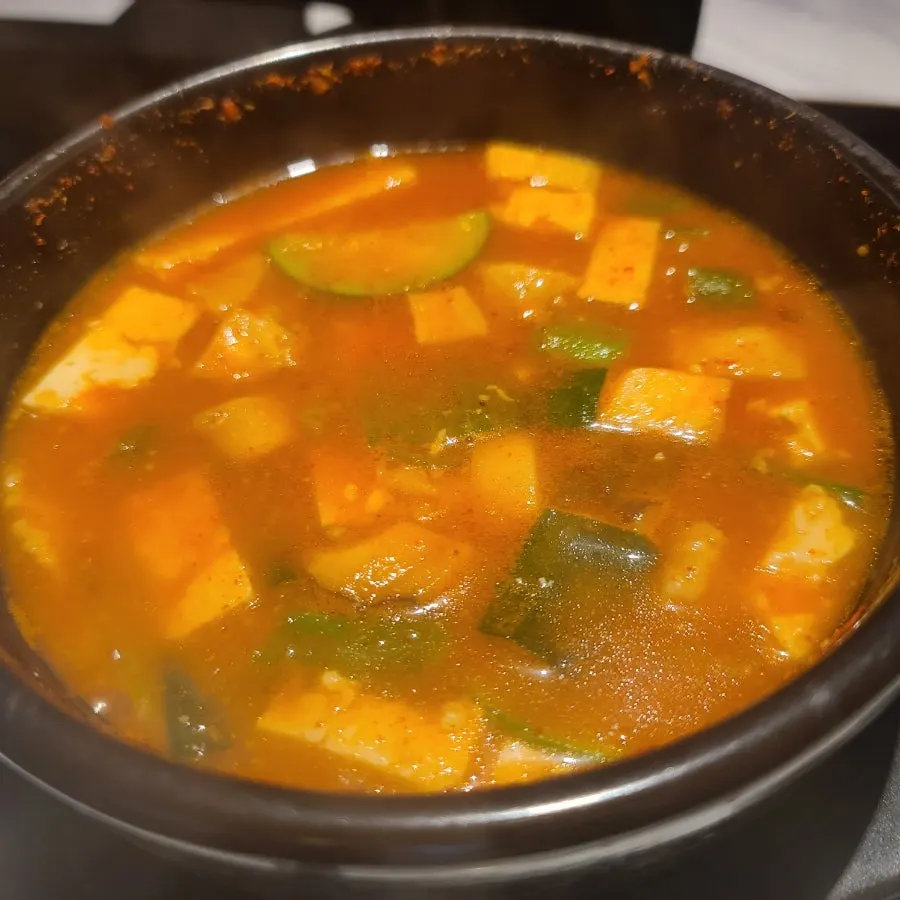 Stone pot doenjang jjigae with tofu and zucchini