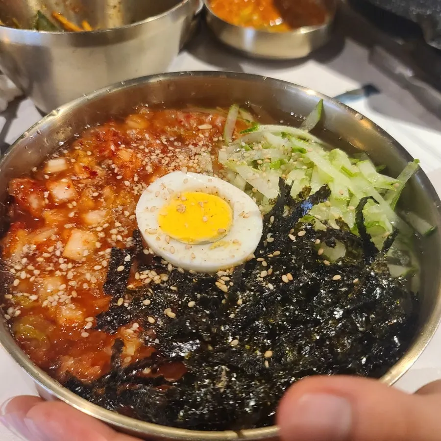 Kimchi-mari guksu in a slush-ice broth
