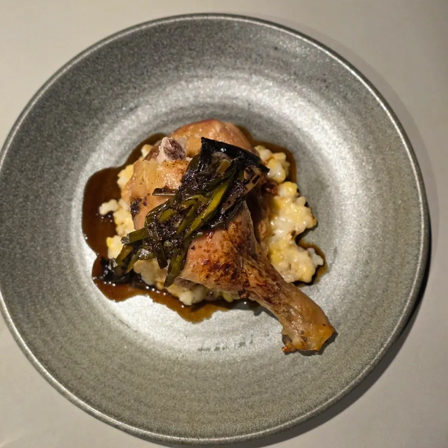 The main dish served with mung bean rice and grilled green onion kimchi