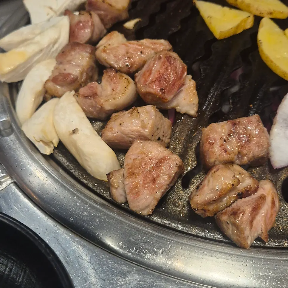 Raw pork neck placed on the grill