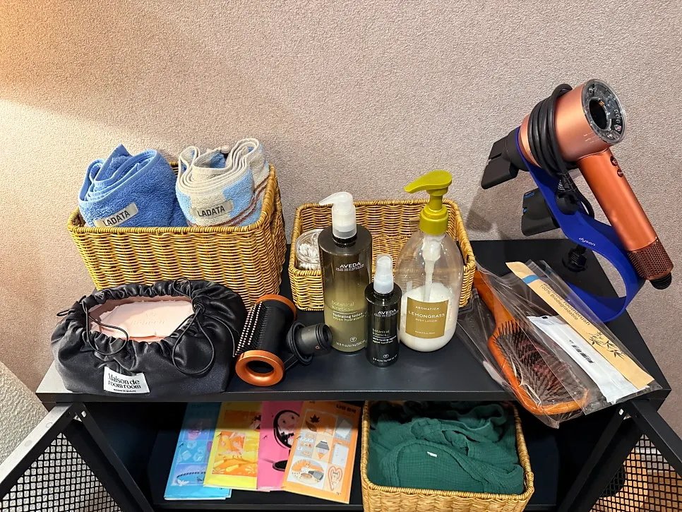 Sauna supplies arranged next to a full-length mirror