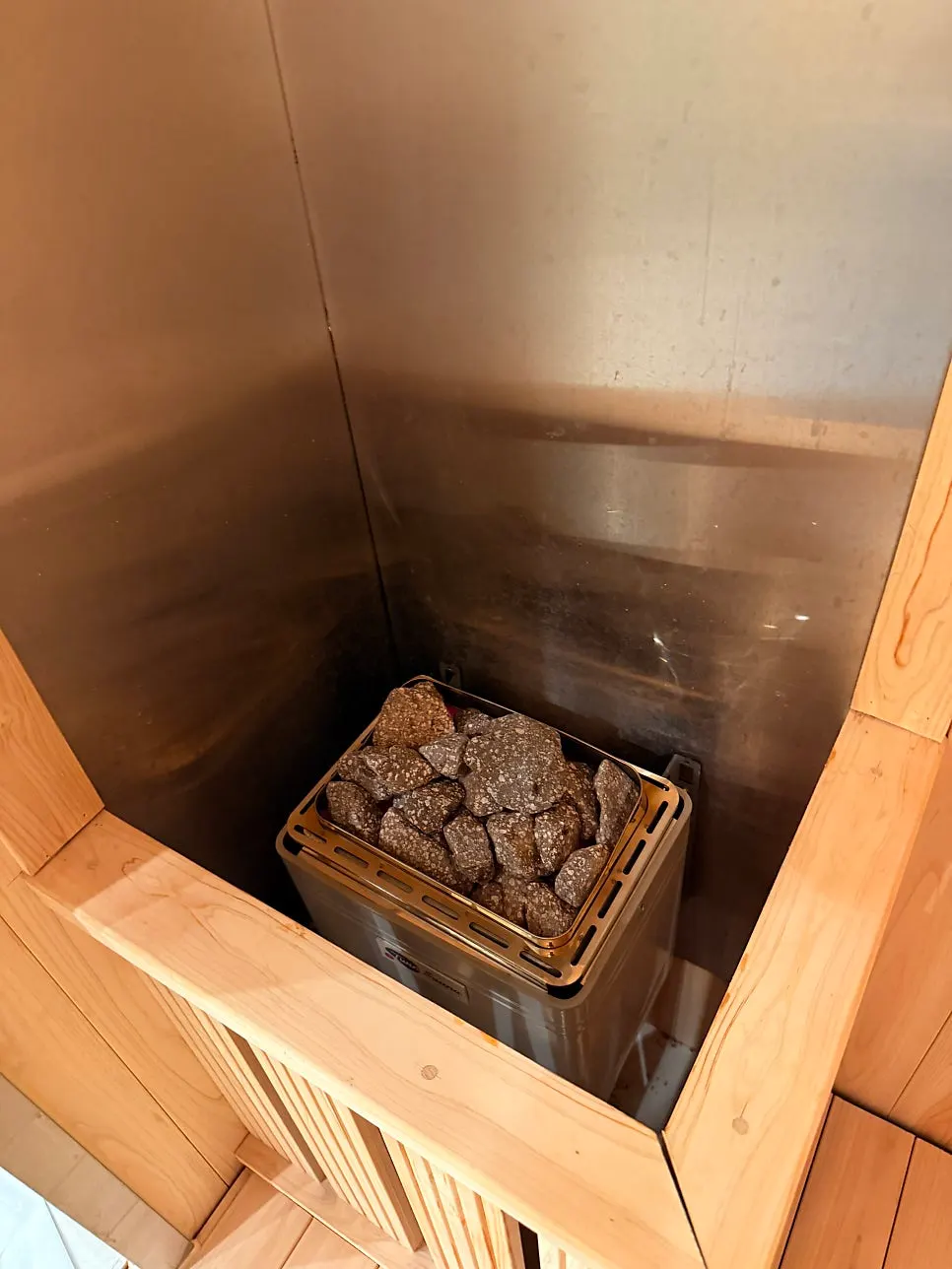 Bench and sauna stones inside the sauna room
