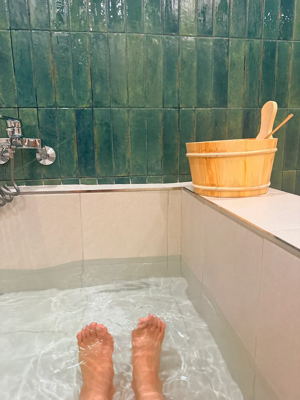 Reading a waterproof book inside the sauna room