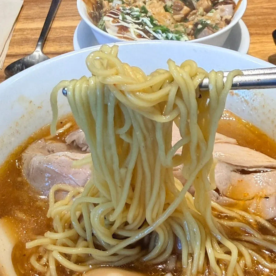 Mini donburi dipped into the ramen broth