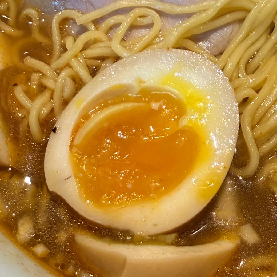 Close-up of spicy shoyu ramen broth and noodles