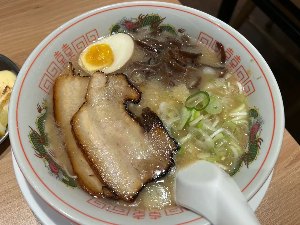 Tonkotsu ramen topped with chashu, soft-boiled egg, and wood ear mushroom